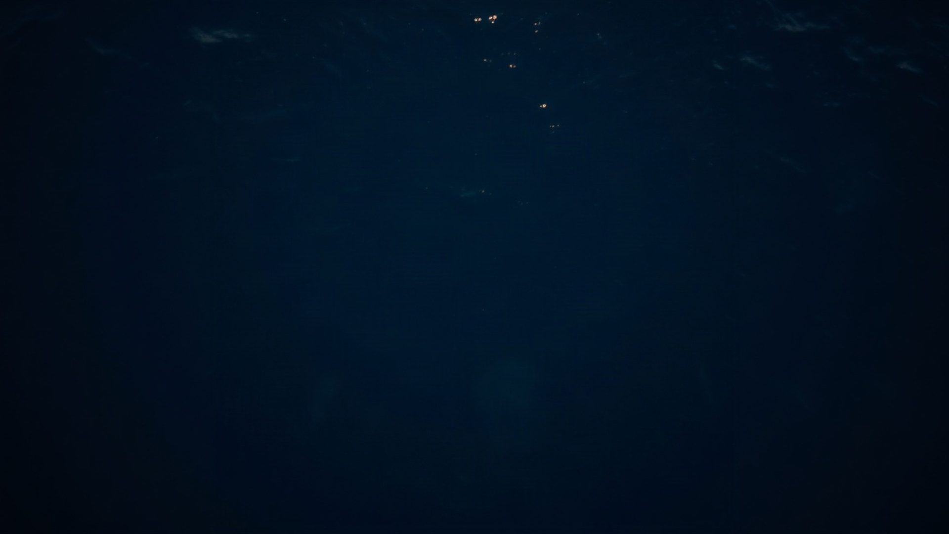 Aerial view of the Kenyan coast at dusk in deep indigo tones